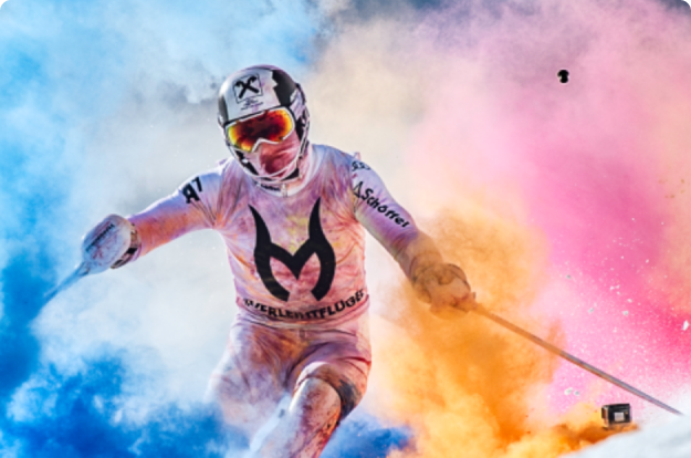 person skiing with colorful background